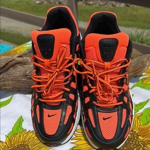Bold Black and Orange Athletic Shoes with Modern Design